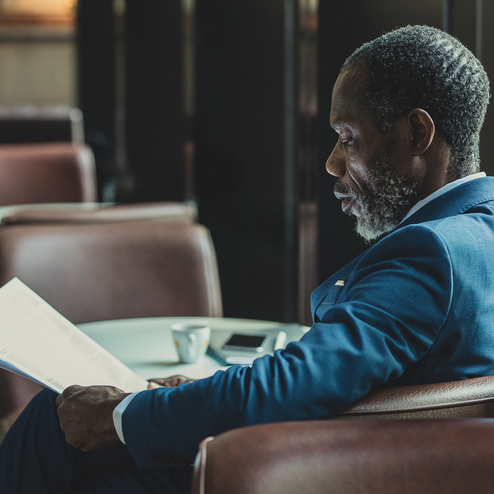 Man reading news article