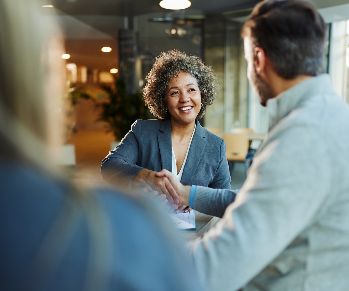 Advisor meeting with clients discussing tax overlay